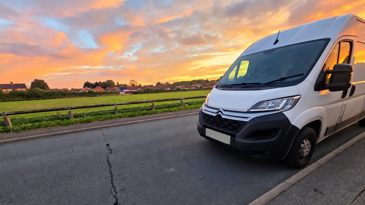 White Citroën Relay van parked at the roadside at sunset