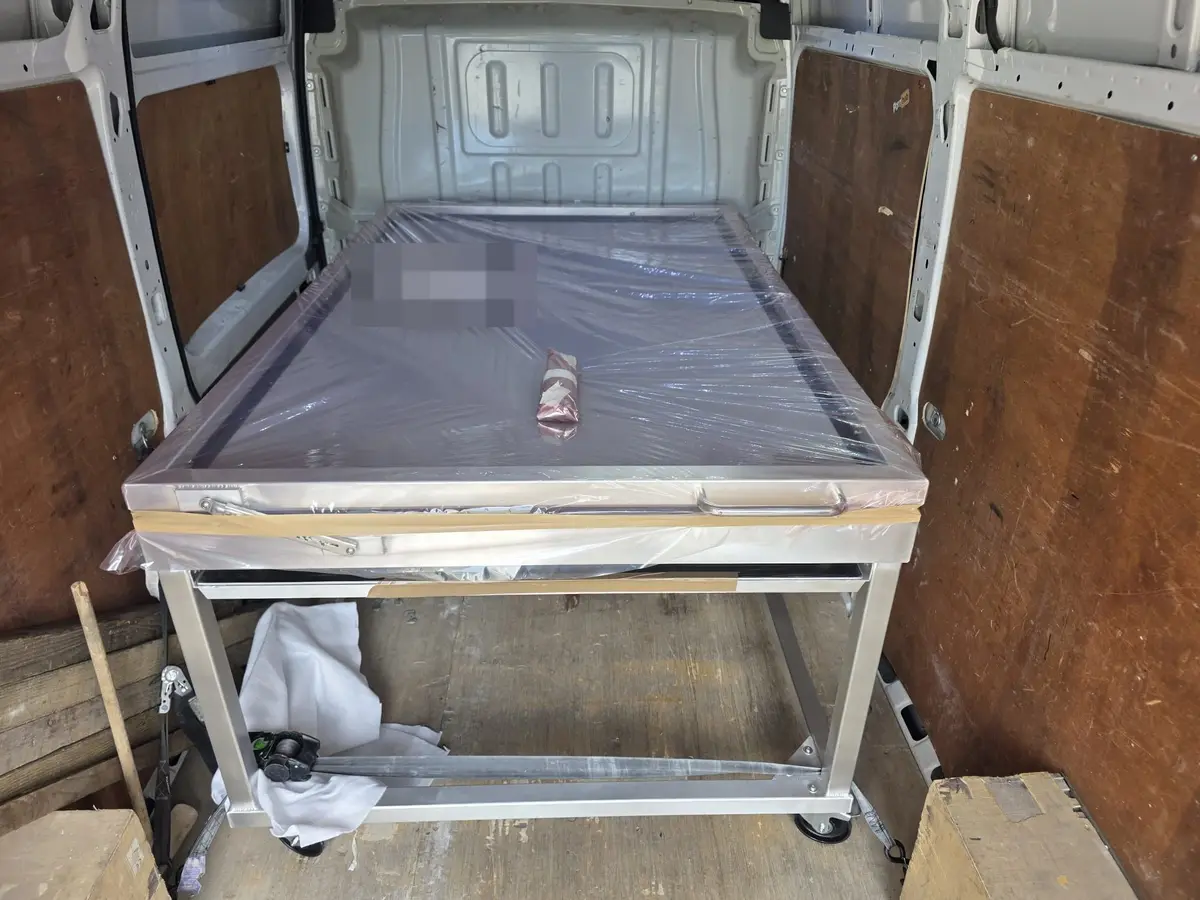Wrapped carbon fibre vacuum forming machine loaded in the Arrow van